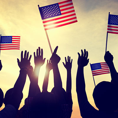 people waving flags silhouettes sun down sky evening fourth of july celebration for nmi neighborhood management lifestyle activity