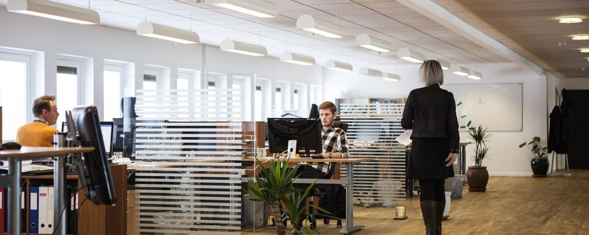 Professional property management team coordinating community maintenance in a modern office
