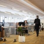 Professional property management team coordinating community maintenance in a modern office