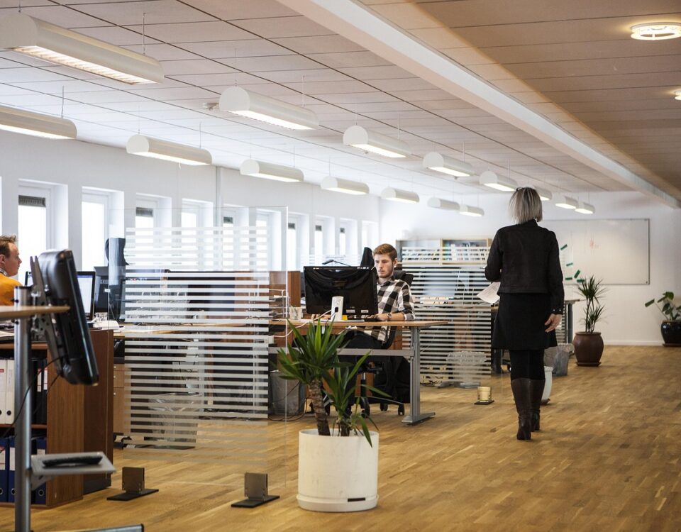 Professional property management team coordinating community maintenance in a modern office