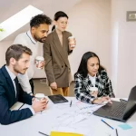 Team of professionals collaborating on a project to strengthen relationships and communication.