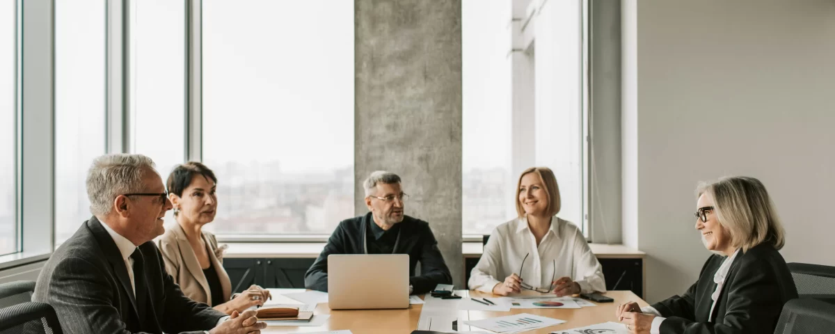 Property management team discussing strategies to increase property values.